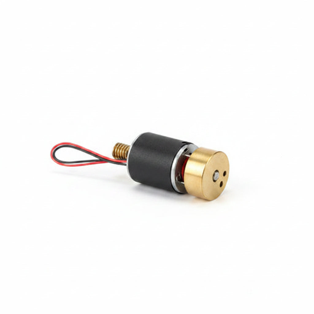 A small Heljan motor with a brass flywheel and black body inside a clear plastic bag with a white paper header card.